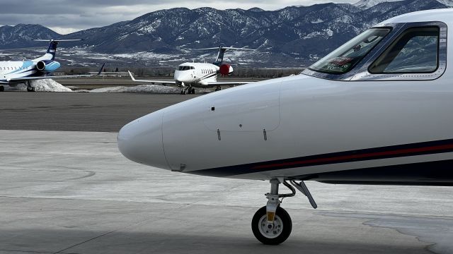 Cessna Citation CJ4 (N845PF) - Standing on the east ramp at the Bozeman airport, Bridger Mountains in the background.