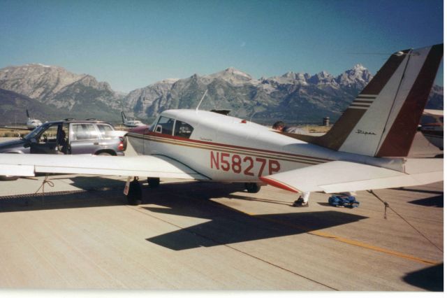 Piper PA-24 Comanche (N5827P) - In Jackson Hole Airport with Tetons in background