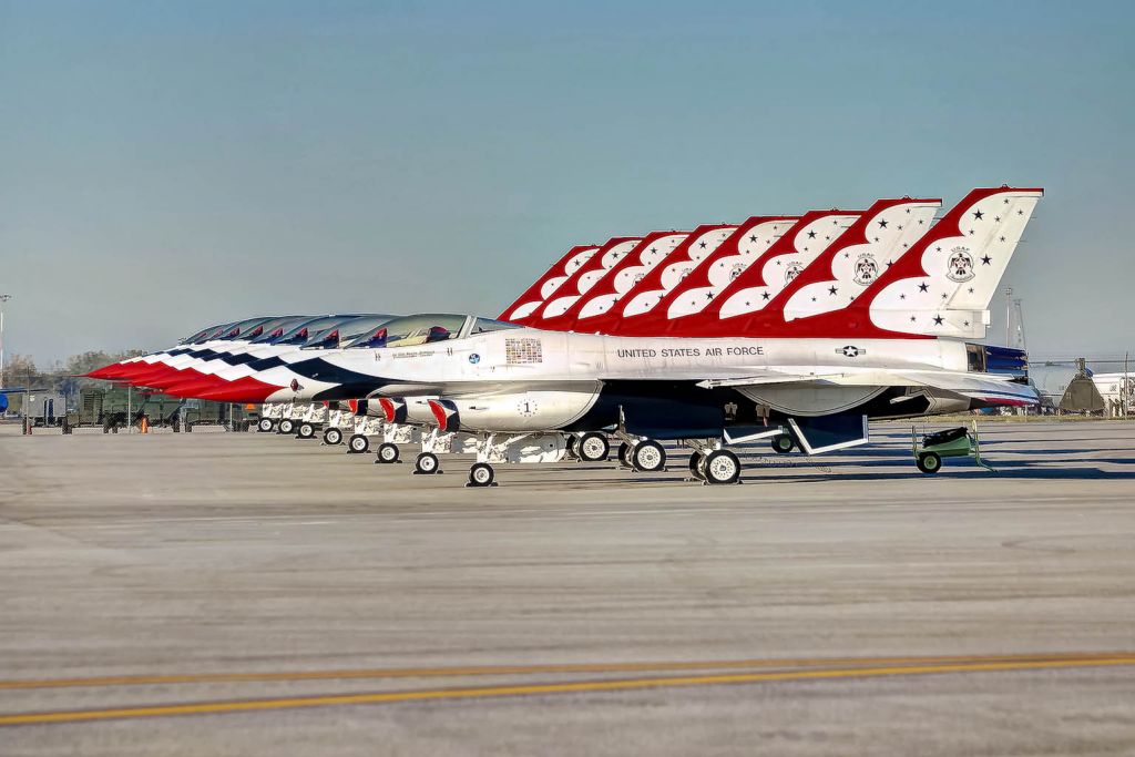 Lockheed F-16 Fighting Falcon — - The U.S. Thunderbirds aircraft are lined up on the ramp for the Gathering of Mustangs and Legends airshow.