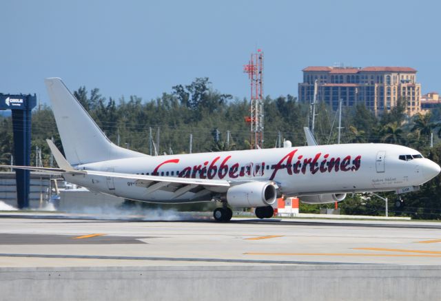 Boeing 737-800 (9Y-SXM) - Touching down on RWY 28L