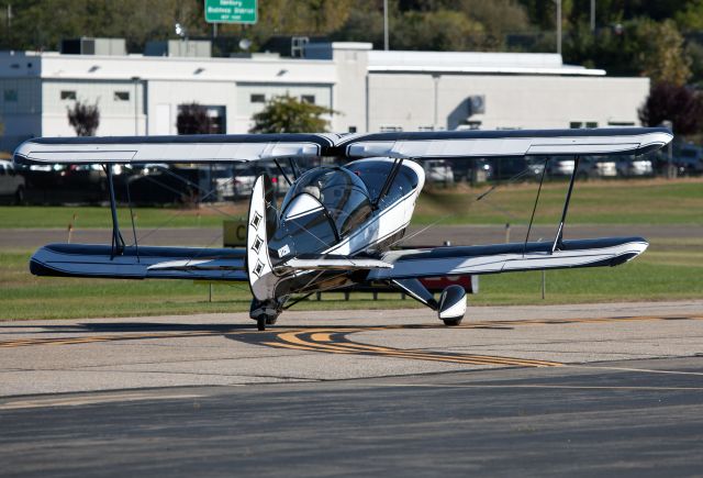 Piper Cherokee (N129D) - Holding short of RW26. RELIANT AIR offers the lowest fuel price on the Danbury (KDXR) airport.