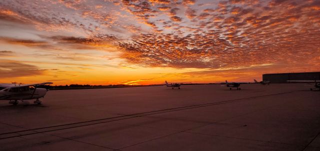 — — - October Sunrise at KCBF looking east from Terminal.