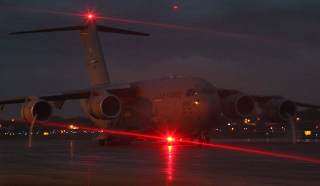 — — - On ramp watching C-17 use reverse thrust to back up. (notice vortices forming on outer engines)