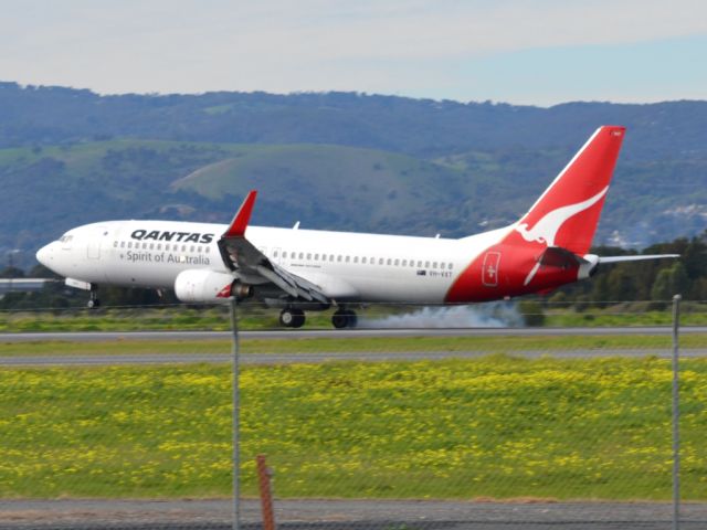 Boeing 737-800 (VH-VXT) - Smoking the tyres on runway 05. Thursday 12th July 2012.