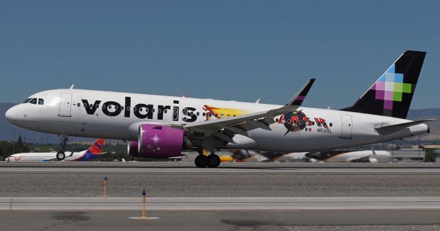 Airbus A320neo (N531VL) - Volaris's N531VL, now in its newest special livery, has the mains down and rolling on 17L as it arrives from Guadalajara.