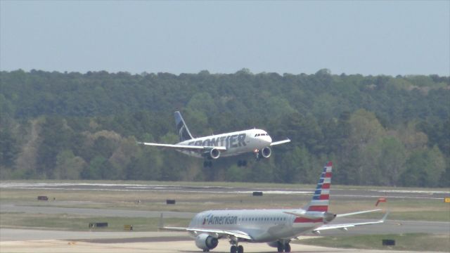 Airbus A320 (N216FR) - Frontier Airlines flight 907, arriving from Trenton Mercer. Taken from the hourly parking deck at RDU