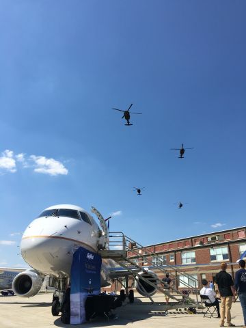 EMBRAER 175 (long wing) (N145SY) - Above the Purdue Aviation Day displays, four Sikorsky Black Hawks perform a fly-over. SkyWests Embraer 175 is in the foreground. 