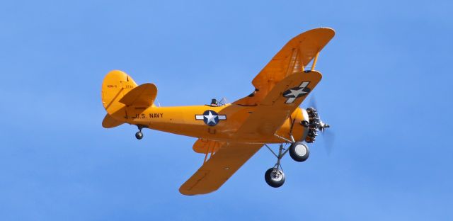 NAVAL AIRCRAFT FACTORY N3N (N4009A) - The Commemorative Air Force High Sierra Squadrons N4009A, a Naval Aircraft Factory N3N-3, is a bright yellow splash of color in the blue northern Nevada sky as it climbs away from Reno Stead (KRTS).