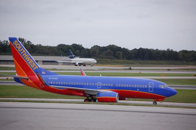 Boeing 737-700 (N776WN) - Taken on 9/26/09 with a former "World" DC-10 in the background.