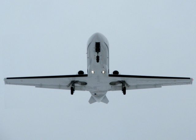 Cessna Citation Mustang (N510BA) - Landing on runway 05 at Shreveport Regional. Hard to tell but it is snowing.