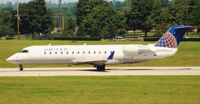 Canadair Regional Jet CRJ-100 (N983CA) - This former Comair CRJ-100ER operating as a United Express flight is seen departing runway 22 at KLEX Lexingtons Bluegrass Airport in the summer of 2016.