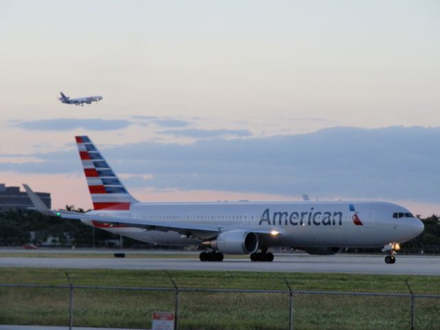 BOEING 767-300 (N387AM) - FedEx MD11 In the foreground!