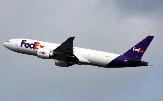 BOEING 777-200LR (N850FD) - Climbing from Rwy 16R