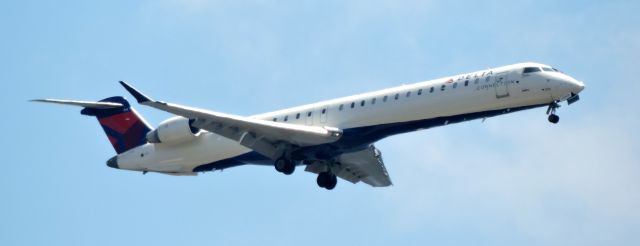 Canadair Regional Jet CRJ-900 (N836SK) - This Delta Connection is moments from landing, summer 2019.