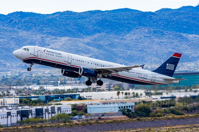 Airbus A321 (N578UW) - American Airlines A321 in US Airways retro livery taking off from PHX on 12/16/22. Taken with a Canon R7 and Tamron 70-200 G2 lens.