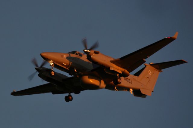 Beechcraft Super King Air 300 (N128J) - Border Patrol King Air landing above me during golden hour. Taken on Locust Beach. 