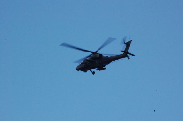 — — - AH-64D taking off from 1 at CXO.