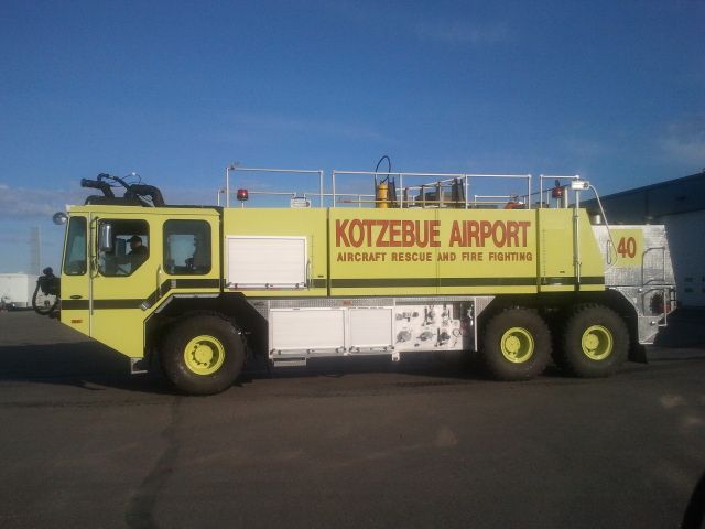 — — - E-One Titan, Engine 40 - Crash 1, at the Kotzebue Alaska ARFF Station.