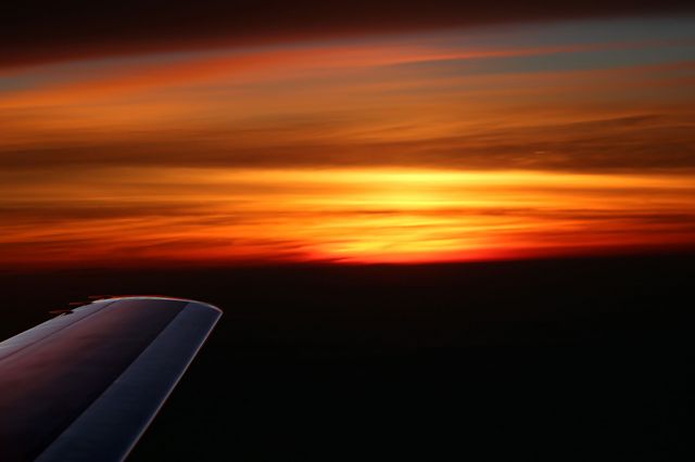 — — - Atlantic sunset flying Florida to UK May 6,2012