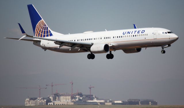 Boeing 737-900 (N36476) - Arrival 34R. In the background is the giant event center being constructed southwest of DIA.