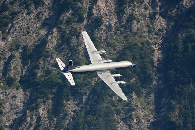 Douglas DC-6 (OE-LDM) - Turning over Wolfgangsee in front of mountains