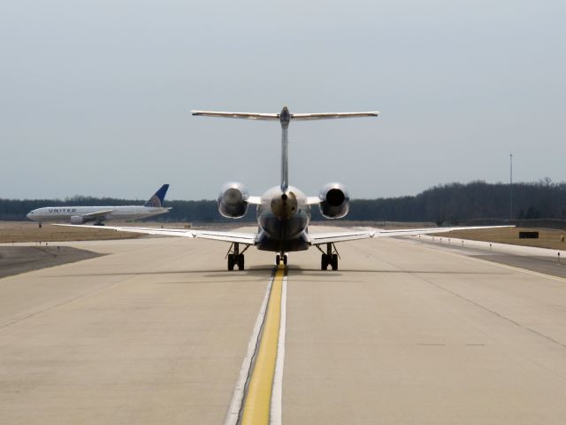 Embraer ERJ-145 (N843HK) - Starting the left engine after a long taxi.