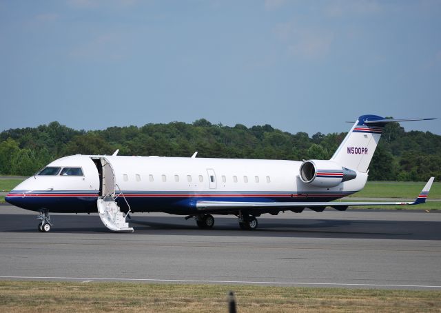 Canadair Regional Jet CRJ-200 (N500PR) - PENSKE RACING INC parked at Concord Regional Airport / Concord, NC 7/28/11