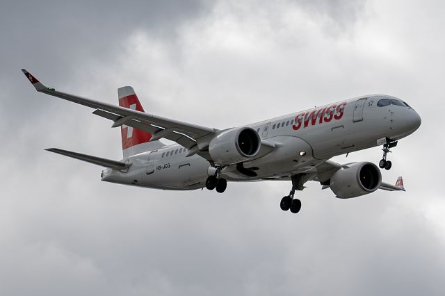 Airbus A220-300 (HB-JCG) - SWR352 / LX352 from Geneva Cointrin Int'l (GVA / LSGG) on short final at London Heathrow (LHR / EGLL) on 14 Jun 2024. HB-JCG is a Bombardier CS300, which was built in Canada, now known as an Airbus A220-300 (BCS3).