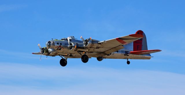 Boeing B-17 Flying Fortress (N3701G) - Flashback to 2017 ~~br /"Madras Maiden,' a B-17G (N3701G, previously "Chuckie," repainted and renamed in 2019 - now currently named "Ye Olde Pub") as it was on approach to KRNO's 16L.br /Modified to a B-17F and renamed "Ye Olde Pub" two years after this pic was taken, N3701G now resembles the bomber that is known for its encounter with a German fighter in the skies over Europe.br /** NOTE: Read the book "A Higher Call" by Adam Makos to learn the true story of a German fighter pilot who encountered the severely damaged and crippled "Ye Olde Pub" and made the decision to escort the bomber to safety instead of shooting it down. **