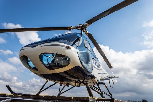 Enstrom 280 Shark (N200EH) - An Enstrom F-28A sits on the pad at Warren County Airport.