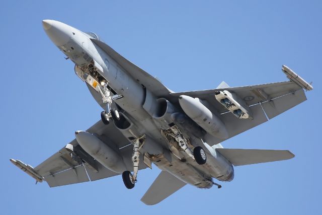 — — - RAAF Boeing F-18 approaches Townsville Airport.