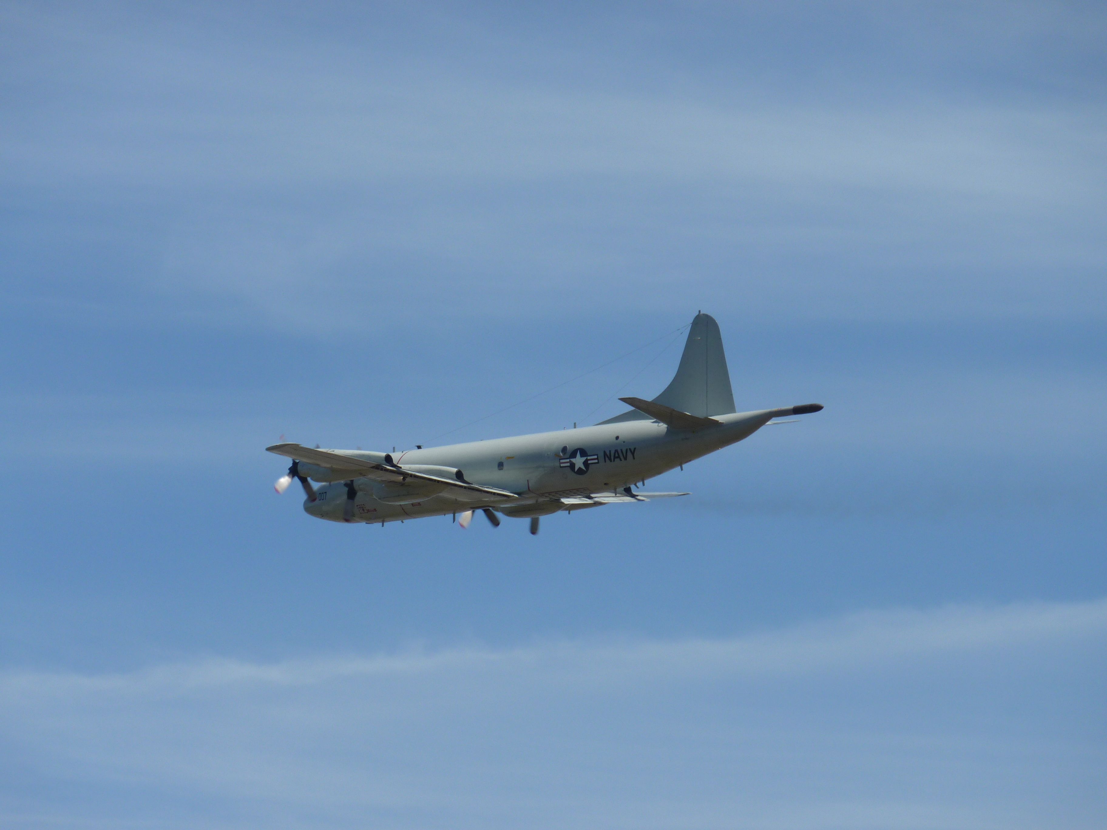 — — - Performing one of many touch and goes at Paine Field.