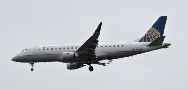 EMBRAER 175 (long wing) (N88341) - Moments till landing, spring 2019.