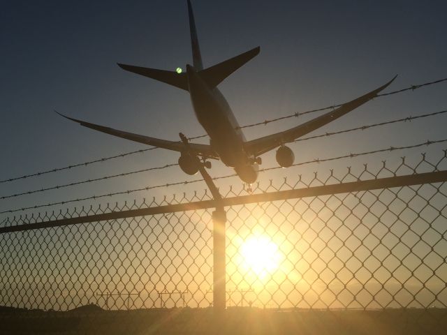 Boeing 787-9 Dreamliner (C-FGDZ) - disappointed that the fence got in the way... (this was taken from an iphone so excuse the lack of quality!)