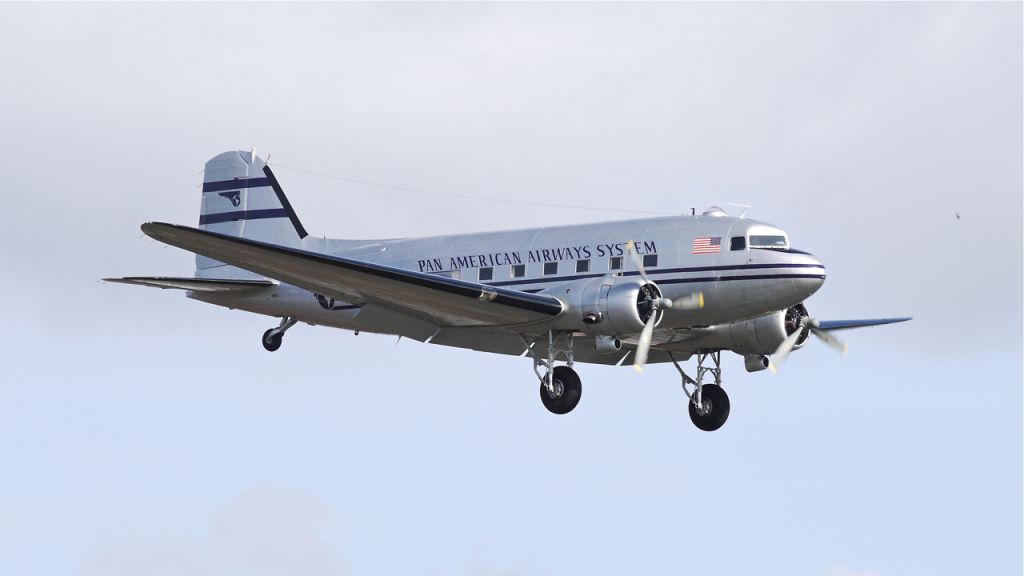 Douglas DC-3 (N877MG) - Historic Flight Foundations new DC3C on final approach to runway 16R on 2/27/13. (Ser#4193).