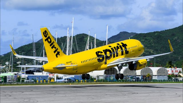 Airbus A320 (N644NK) - Spirit wings departing TNCM St Maarten climbing the hills.