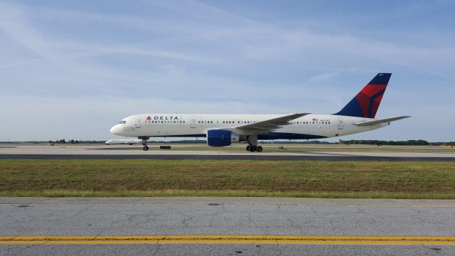 Boeing 757-200 (N6716C) - As seen from the cell phone waiting lot at KATL