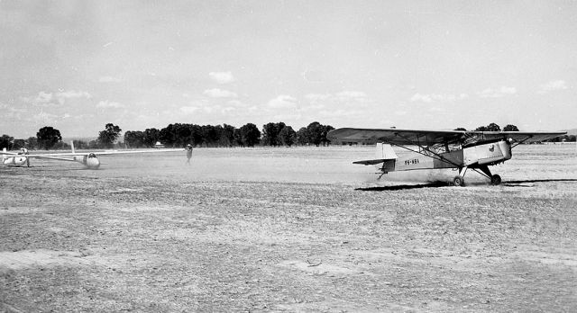 TAYLORCRAFT (2) E (VH-MBA) - Auster 3F towing a glider at Benalla Victoria March 1968. Unfortunately written off in an accident in August 1997. from The Geoff Goodall Collection.