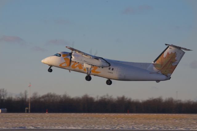 de Havilland Dash 8-100 (C-FACD) - Dash 8 lifts off Runway 25, headed for Toronto and the low Sun of a Winter afternoon..