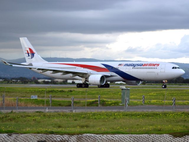 Airbus A330-300 (9M-MTC) - On taxi-way heading for take off on runway 05, for flight home to Kuala Lumpur, just before the arrival of a rain storm. Thursday 12th July 2012.