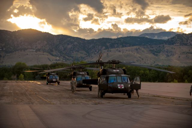 — — - Three National Guard Helicopters assist with the Boulder County Flood operation on September 14,2013. These three helicopters and many more helped evacuation hundreds of people out of the mountains that were stranded due to roads being washed out and rivers flowing higher than ever.