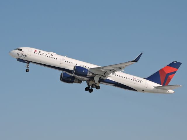 Boeing 757-200 (N694DL) - Departing KMSP on RWY 30L.  The Spirit of Freedom on nose.