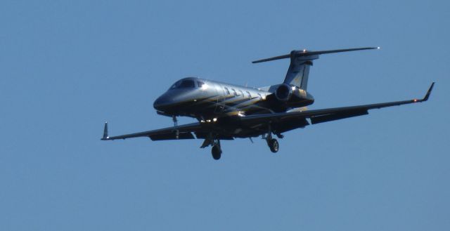 Embraer Phenom 300 (N6A) - On final is this 2017 Embraer 505 Phenom 300 in the Autumn of 2021.