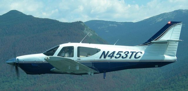 Rockwell Commander 114 (N453TC) - formation flight in Alaska