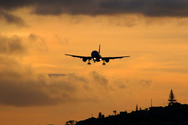 Airbus A320 (HB-IOS) - Airberlin from Zurich approaching Funchal Airport in the last rays on the shortest day of the year