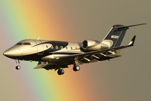 Canadair Challenger (N53DF) - Lands with a rainbow in the background. 