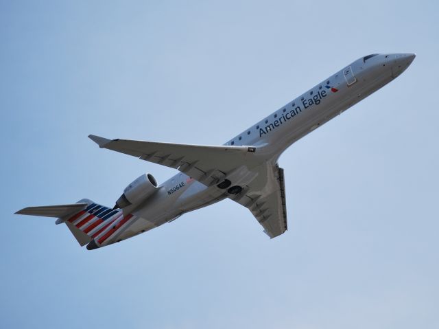 Canadair Regional Jet CRJ-700 (N506AE) - American Eagle new livery at KCLT, but hope that they dont stay with the new branding once American and US Airways complete their merger. Looks like a flying Greyhound Bus. - 4/14/13