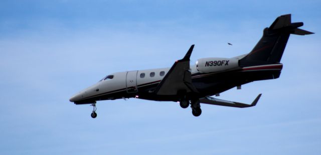 Embraer Phenom 300 (N390FX) - About to touch down is this 2014 Embraer Phenom 300 in the Winter of 2025.