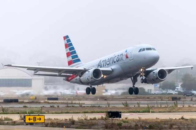 Airbus A319 (N805AW) - Departing through the fog back to DFW goes this flight