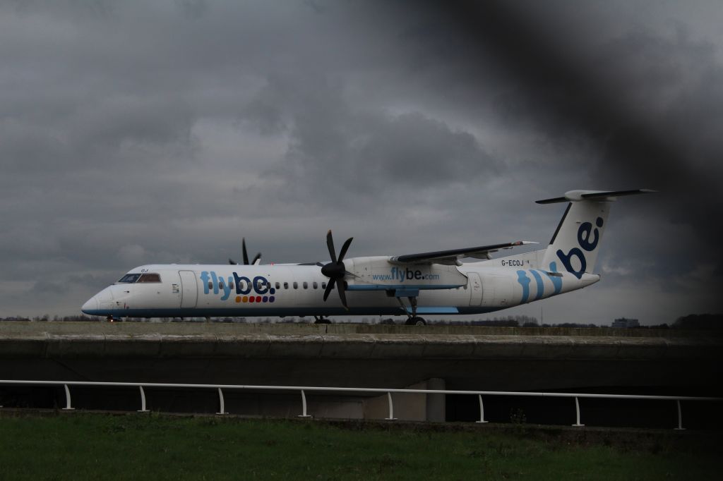 G-ECOJ — - Dash 8 turboprop, FlyBe, taxiing to the runway Polderbaan at Schiphol Amsterdam Airport (Holland).